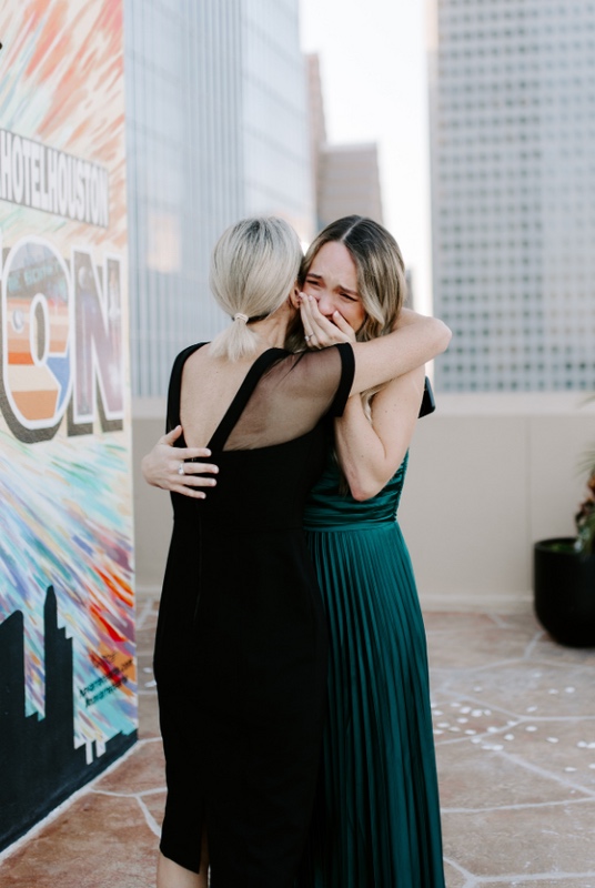 Newly engaged couple celebrating together