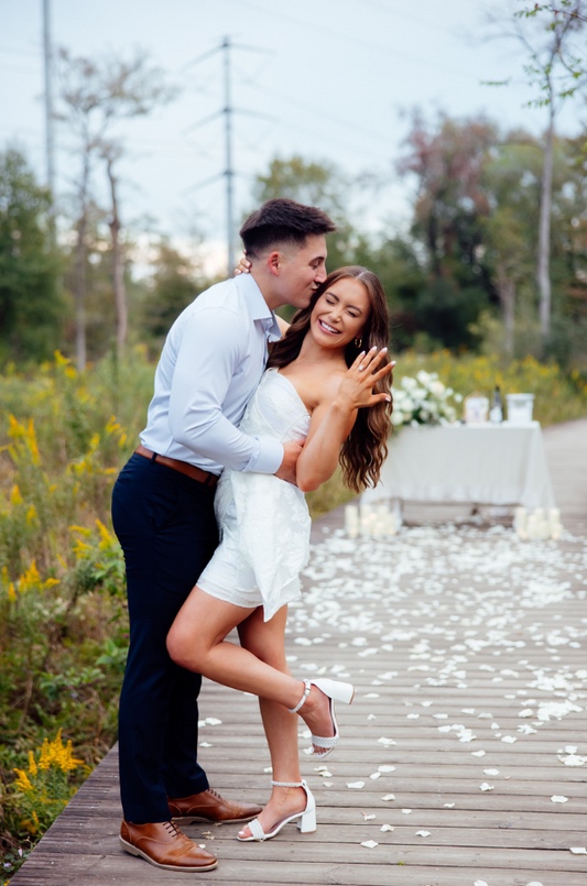 Newly engaged couple celebrating together